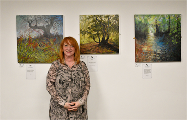 Thumbnail image of Jo Sheppard with her three works: - Beyond Words: An Exploration Of Art And The Written Word