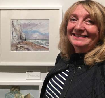 Thumbnail image of Sue Graham with her work at The Open Exhibition - The Open Exhibition
