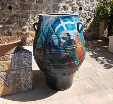 Thumbnail image of One of two painted urns by George Sfougaras in Potamies - Art Abroad - George Sfougaras Paints In Potamies